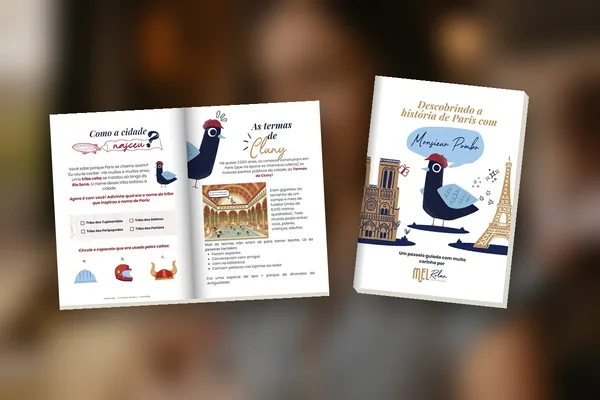 Livro de atividades impresso do Monsieur Pombo, fechado e aberto numa mesa